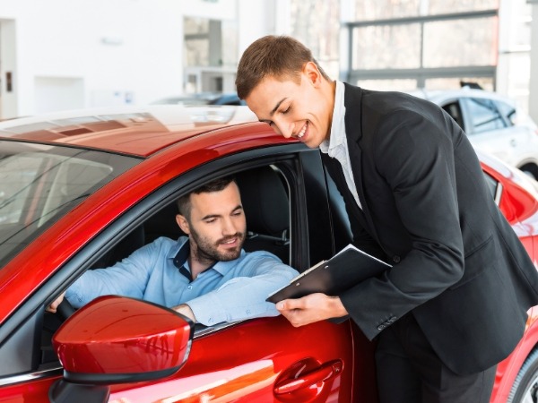 Man Talking to a Car Agent