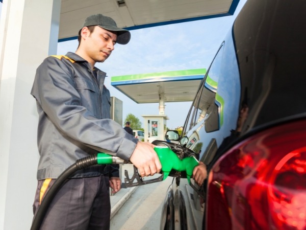 Gas Station Worker Filling a Tank
