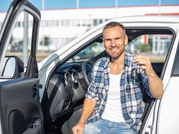 Man with a White Car