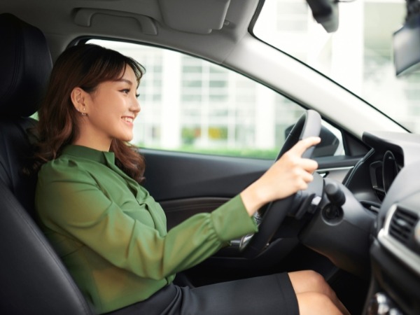 Woman Driving a Car